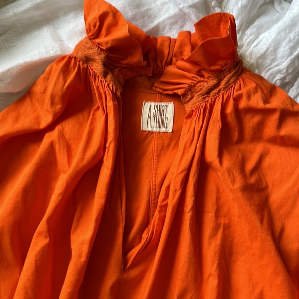 🧡A SHIRT THING” 100% cotton. Orange 🍊 with notes of coral.